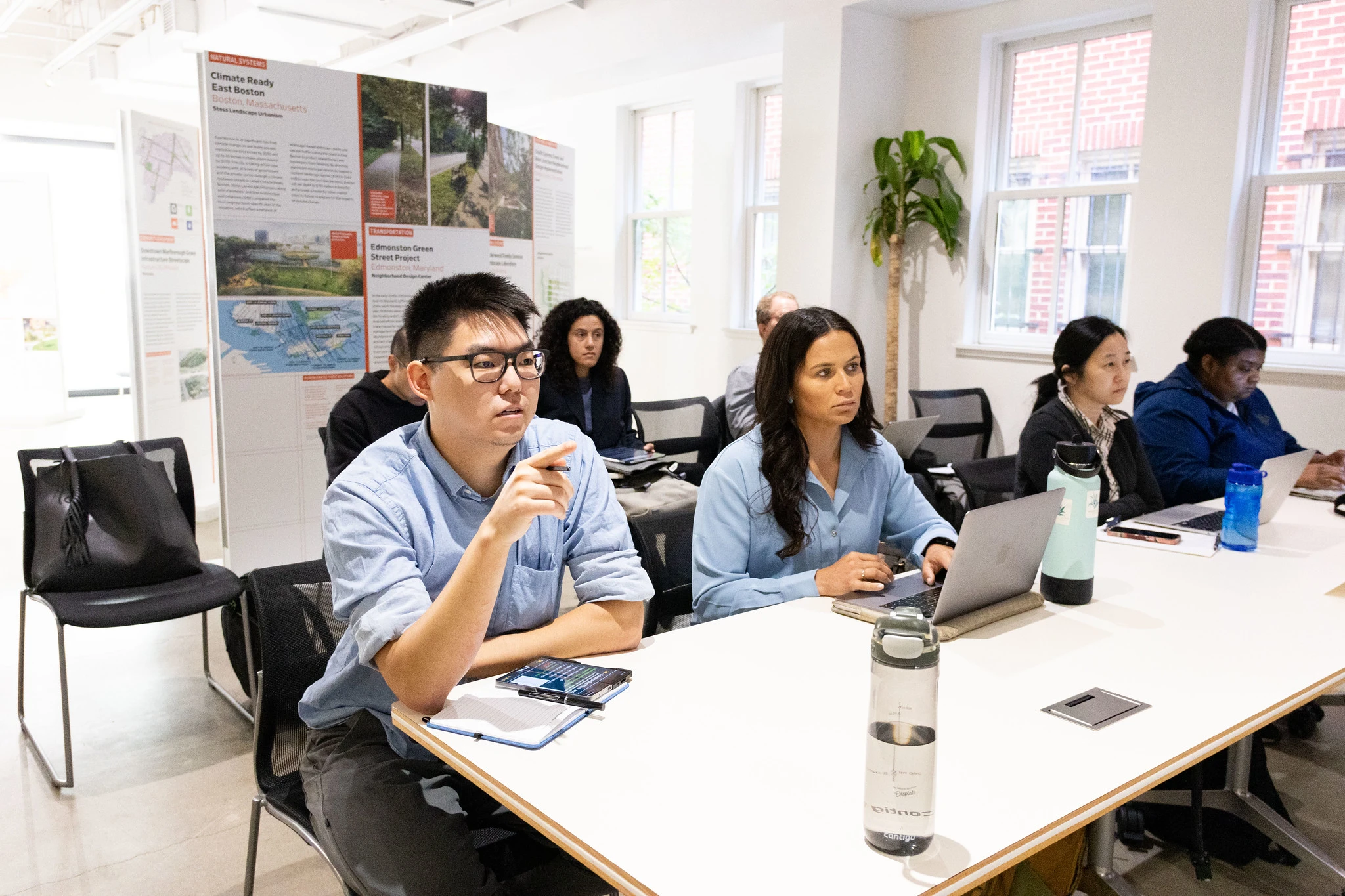 Associate Members collaborating in a room